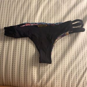 Never worn, reversible, braided side thong.
